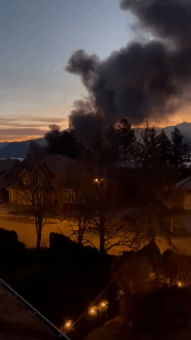 Large Structure Fire Extinguished Amid Flooding in British Columbia