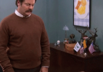 Parks and Recreation gif. Nick Offerman as Ron stares off into space, then shakes his head and looks at us, asking, "What the hell just happened?" which pops up as text.