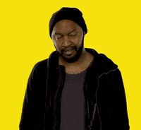 Video gif. Man goes wide eyed as he juts his head out in shock.