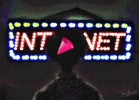 A neon sign saying INTERNET and some shadowy person is watching it with a party popper going off in their head