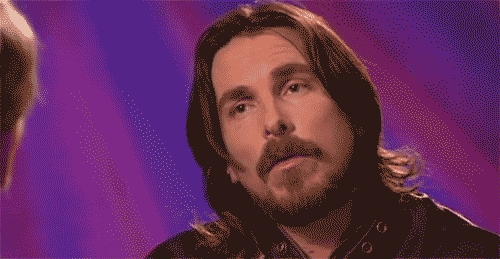 Celebrity gif. Christian Bale spaces out in an interview before furrowing his eyebrows in confusion.