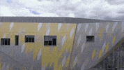 Ad gif. We fly over the top of Bournemouth University and see the entire campus from aerial view. Text reads, "We look forward to welcoming you back on campus soon," and the BU logo appears after.