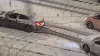 Cars Struggle on Snow-Covered London Roads