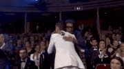 rami malek hugging GIF by BAFTA