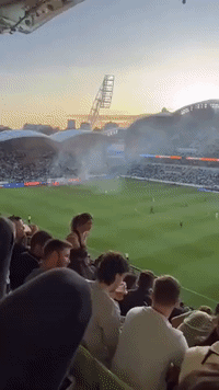 Melbourne Derby Called Off After Keeper Struck in Pitch Invasion