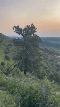 Canadian Wildfire Smoke Causes Hazy Sunrise in Colorado's Red Rocks Park