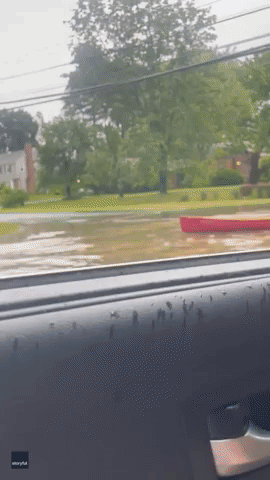 Man Kayaks on Flooded Street in Hartford