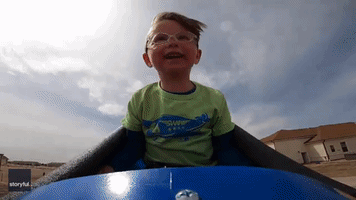 Toddler Enjoys First Ride on Rollercoaster