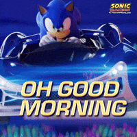 Sponsored gif. Sonic the Hedgehog flies through the air in his race car in slow motion. Text reads, “Oh good morning.”
