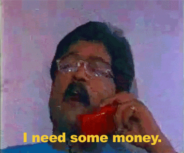 Video gif. Man is on a red landline phone and he says, "I need some money." He takes a beat and peers down at us above his glasses and ends with, "Immediately."