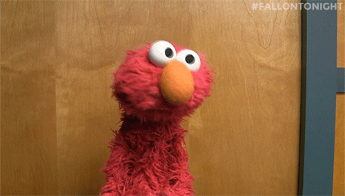 Sesame Street gif. Elmo adamantly shakes his furry redhead "no."