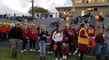 Navy Sailor Surprises Younger Brother at High School Football Game
