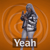 Video gif. Woman wearing silver futuristic clothes, hair, and face paint holds her sunglasses in her hand. She points at us with the sunglasses, clicking her tongue, and says, “Yeah.”
