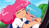 Cartoon gif. In a scene from High Guardian Spice, Rosemary rubs her cheek against Sage's as they share a cheerful hug.