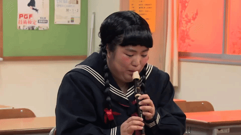 flute playing comedy GIF