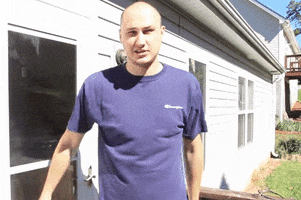 Video gif. Man rips his T-shirt, saying, "Boom."