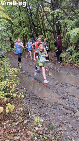 Athlete Dives Into Mud Puddle During Race