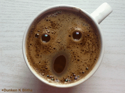 Video gif. Bubbles in a mug of coffee make a shocked face. One eye winks at us while the mouth warps into a crooked smile.