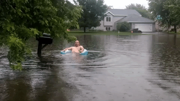 Minnesota Man Floats in Fourth of July Flooding