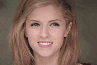 Celebrity gif. Anna Kendrick smiles exuberantly, then squints as she turns her head slightly.