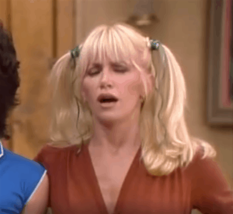 TV gif. Suzanne Somers as Chrissy in Three's Company looks perplexed as she rests a finger on her chin, then sticks out her tongue and scrunches her nose.