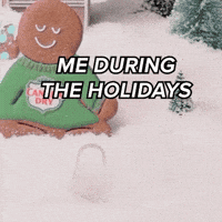 Sponsored gif. A gingerbread man in a Canada Dry sweater relaxing in a snowy scene. A hand places a second gingerbread man in a Canada Dry sweater, this cookie is lounging on its side. Text: "ME DURING THE HOLIDAYS"