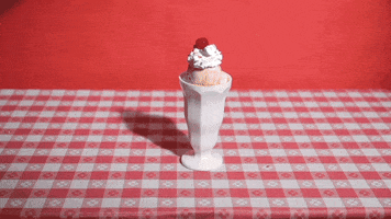 Video gif. Ice cream sits in a tall cup with a cherry on top as many cherries drop from above onto the ice cream. Text appears, "Pretty Please."