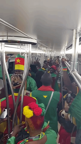 Cameroon Fans Dance and Sing on Metro 
