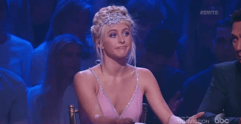 Reality TV gif. Julianne Hough sits as a judge on Dancing With The Stars and nods slowly, pursing her lips in agreement.