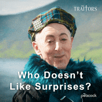 Sponsored gif. Alan Cumming as host of The Traitors dressed in a plaid hat and a furry teal scarf gives a cheeky smile. Text reads, “Who doesn’t like surprises?”