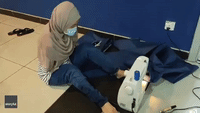 Malaysian Woman With No Arms Sews PPE With Feet