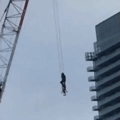Firefighter Rescues Woman From Crane in Toronto
