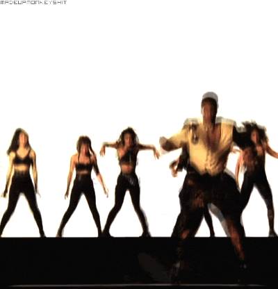 Music video gif. From the video for U Can't Touch This, MC Hammer does the Hammer dance and crabwalks left while female dancers perform in a line in the background.
