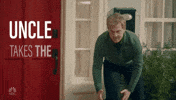 SNL gif. Blond man snarls aggressively, leaning forward like he's ready to receive a football or charge someone. Text pops up on the side like an ad, reading "Uncle takes the game too seriously."