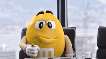 Celebrity gif. Yellow M&M raises his eyebrows and lifts a pointed finger to the sky, saying, "Oh, I know!" which also appears as text.