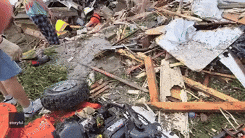 Rescue Workers Pull Woman From Rubble After Deadly Tornado Rips Through Greenfield