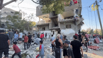 Gazans Search House Damaged by Strike West of Khan Yunis