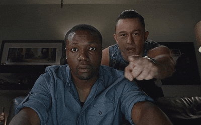 Movie gif. Joseph Gordon-Levitt as Don Jon and Rob Brown as Bobby in Don Jon. They're both looking at a computer screen and Don points at something on the screen and Bobby's eyes go wide. He begins to dance and delights in the image he's seeing.