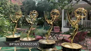 Bryan Cranston Does Yoga With His Emmys