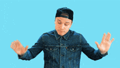 Video gif. Influence Matt Cutshall throws his hands in the air and shakes his head as if to say, “Fine, whatever.”