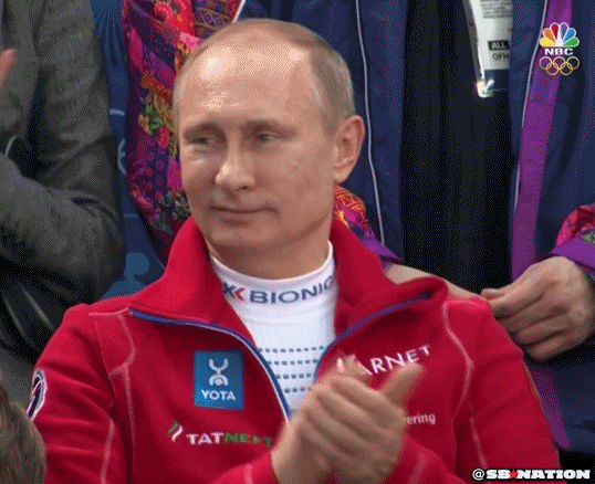 Political gif. Vladimir Putin at the Olympics smiles smugly and claps.