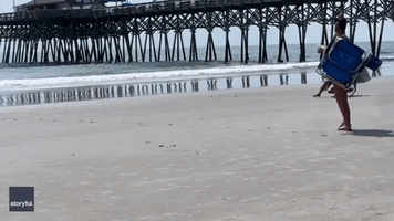 Man Zooms Across South Carolina Beach on Innovative Motorized Beach Chair
