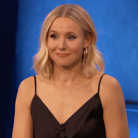Celebrity gif. Actress Kristen Bell aggressively shrugs her shoulders with a feigned expression of ignorance. 