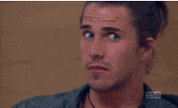 TV gif. We see a close-up of a man, his eyes wide. He looks back and forth uneasily before grimacing widely, obviously uncomfortable.
