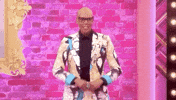 Reality TV gif. RuPaul from RuPaul's Drag Race gives us an excited set of finger guns, "Text, Go!!"