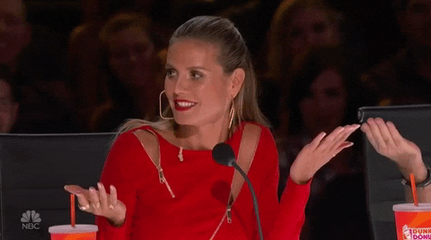 Heidi Klum Shrug GIF by America's Got Talent