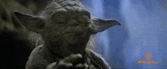 Star Wars gif. Yoda settling into a meditative trance, his arm extended, summoning the power of The Force.
