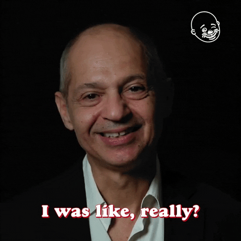 Video gif. Caveh Zahedi, a director, is being interviewed on Eternal Family TV and he smiles with nostalgia and shakes his head slightly as he says, "I was like, really?"