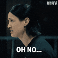 Sponsored gif. Male version of Jordan Li from the Amazon Prime show Gen V looks around with a terrified look on his face. Text reads, “Oh no…”