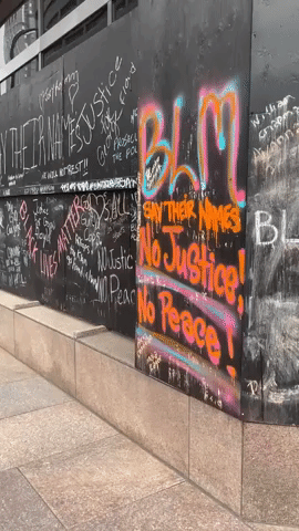 'Justice for George' Graffiti Seen on Wall Outside Derek Chauvin Trial